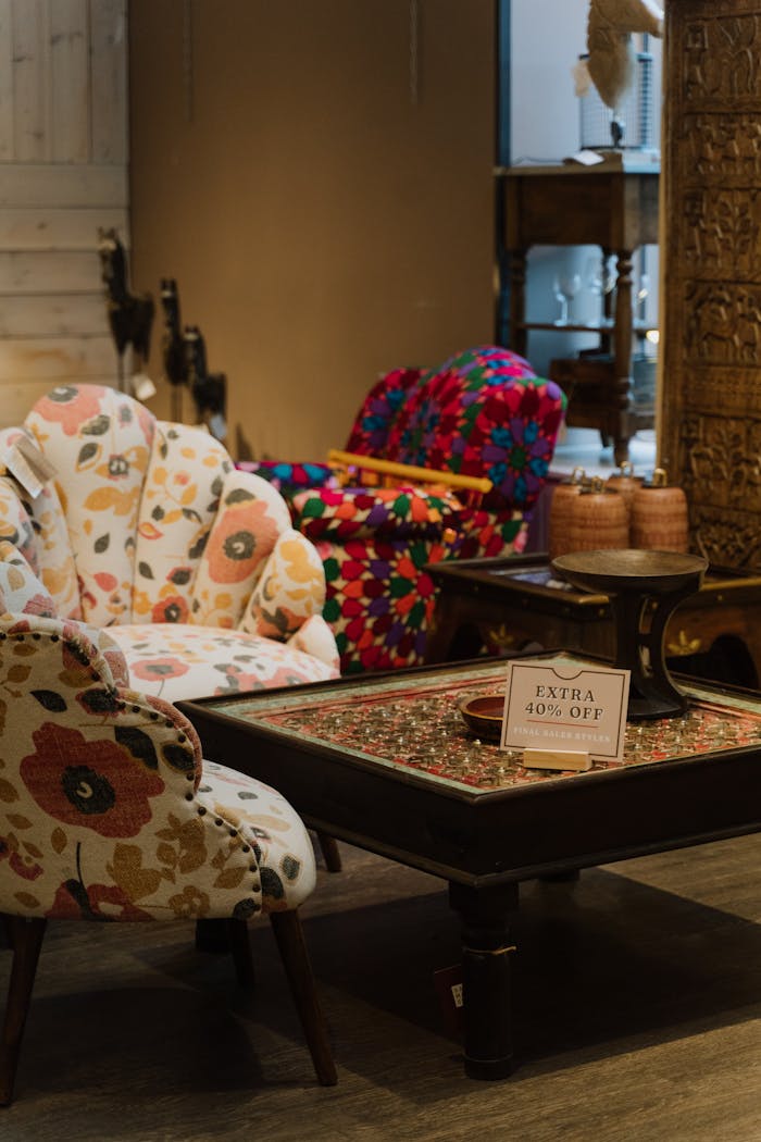 gallery-4 Colorful armchairs and coffee table in a cozy furniture store with sale signs.